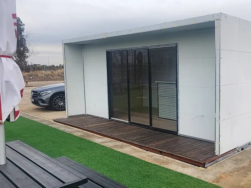 Sliding glass front and external cladding