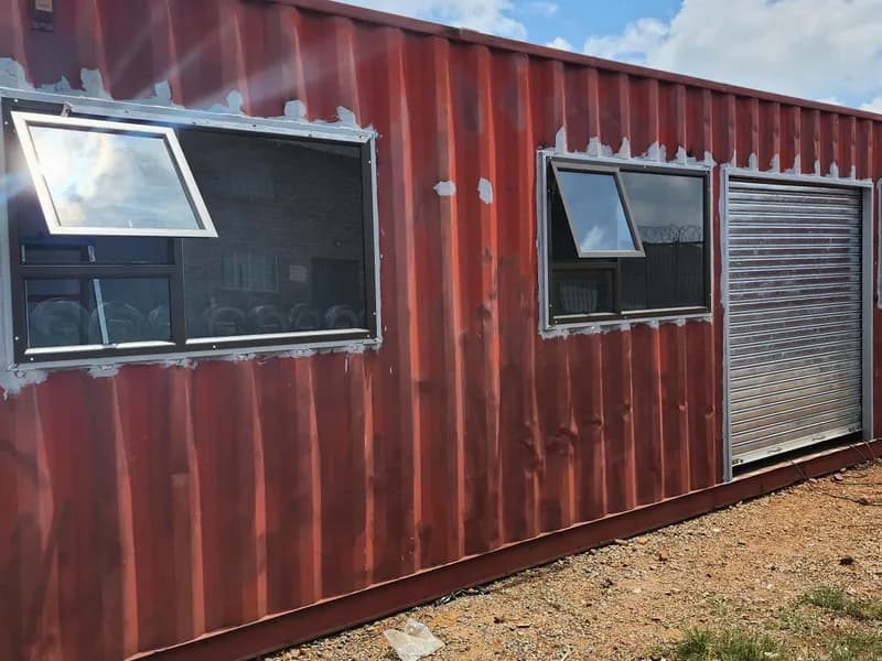 Glazed windows and a shutter along one side