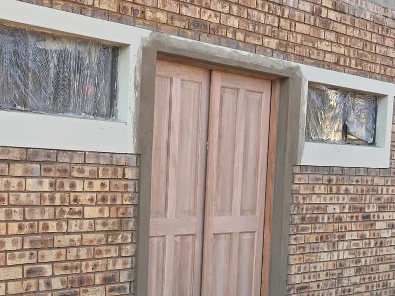 Timber doors hung in face brick